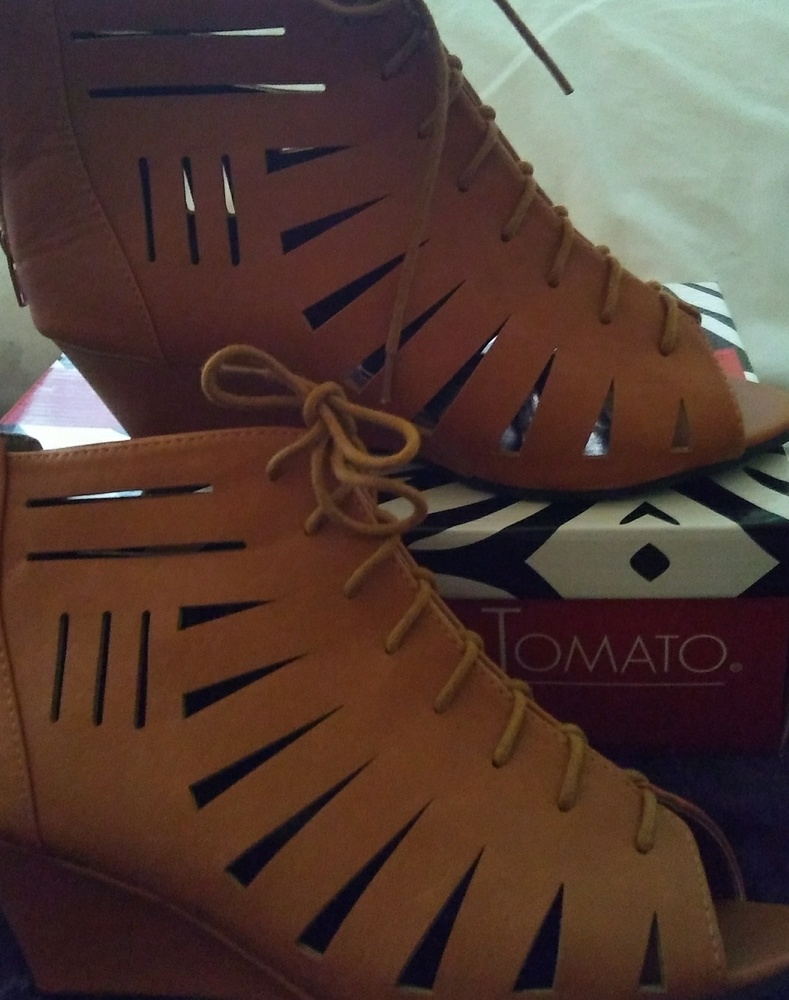 Cognac laser cut open toe shoes.